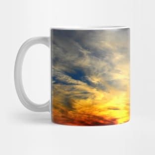 Interesting scene with filamentous clouds and alternating cold and warm colours of the sky Mug